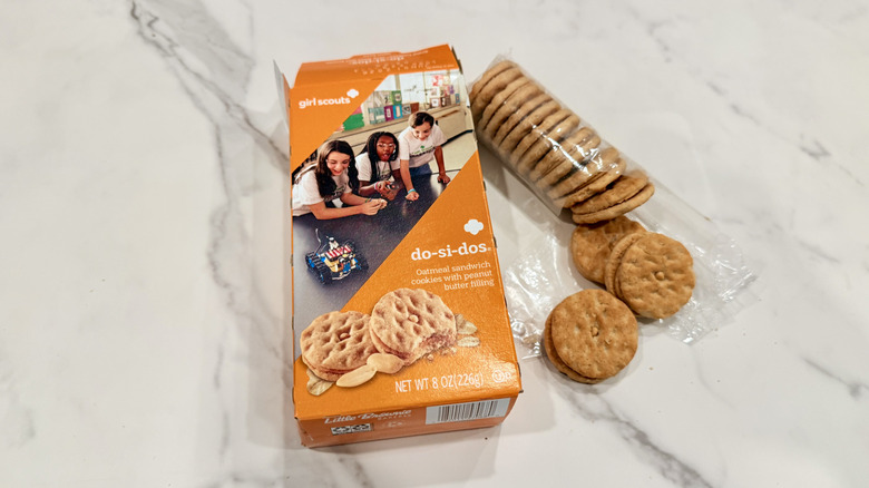 Open package of Do-si-dos cookies on a counter with some of the cookies taken out