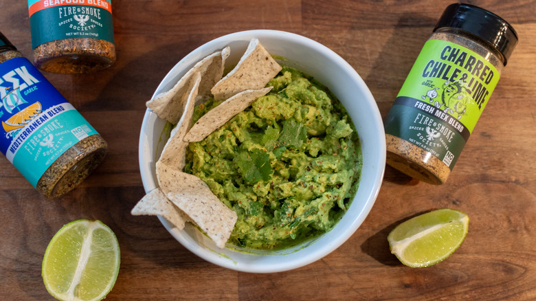 bowl of guacamole with tortilla chips and charred chili and lime seasoning blend