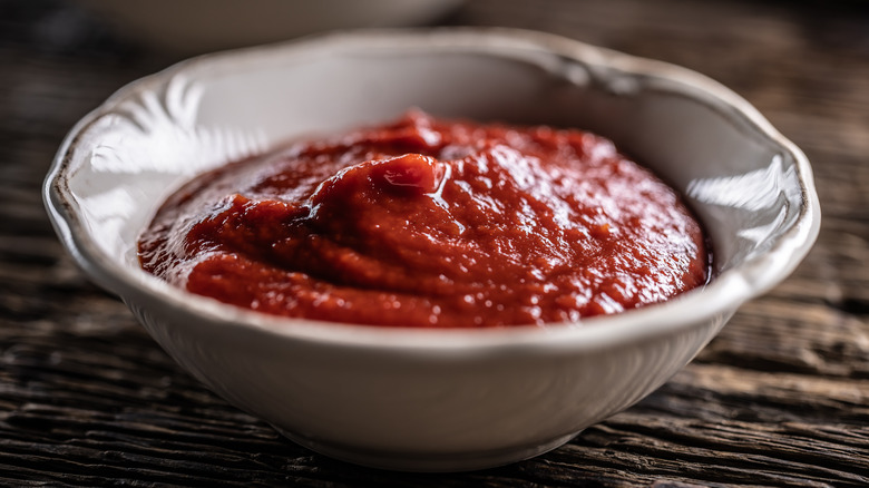 A small bowl of tomato ketchup