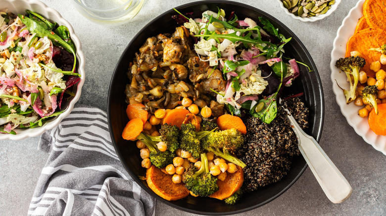 Grain bowl featuring veggies such as sweet potatoes, chickpeas, and broccoli