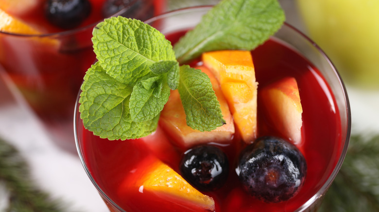 Red sangria garnished with mint.