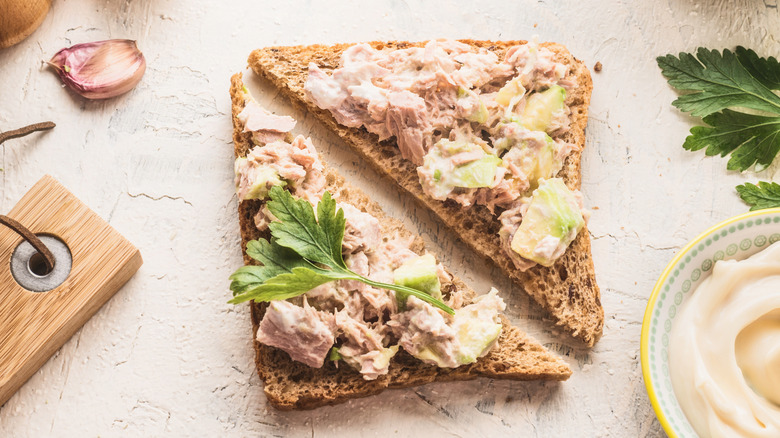 Close up picture of tuna salad on diagonal slices of toast