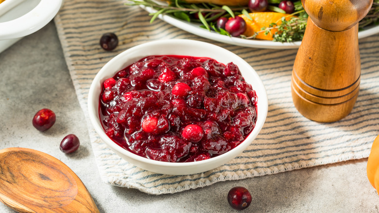 A small pot of cranberry sauce.