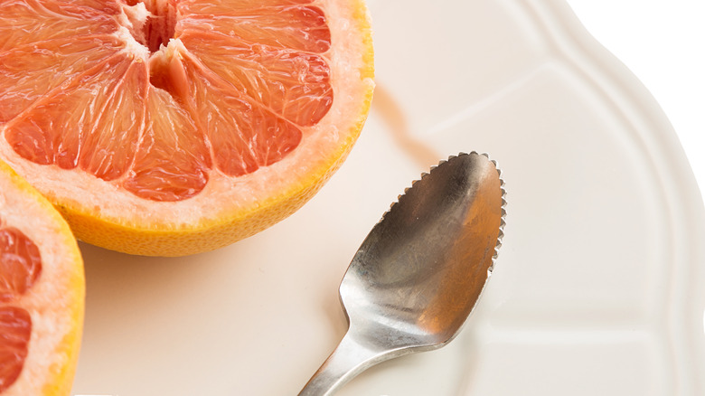 Serrated grapefruit spoon and fruit
