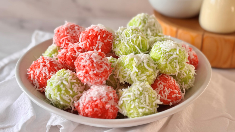 Red and green Jell-O balls in bowl