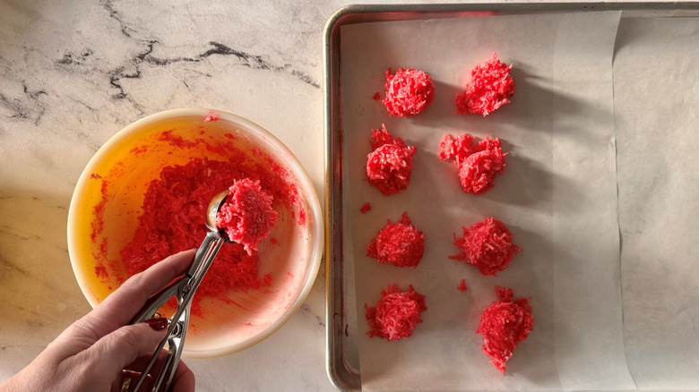 Cookie scoop scooping out red Jell-O balls