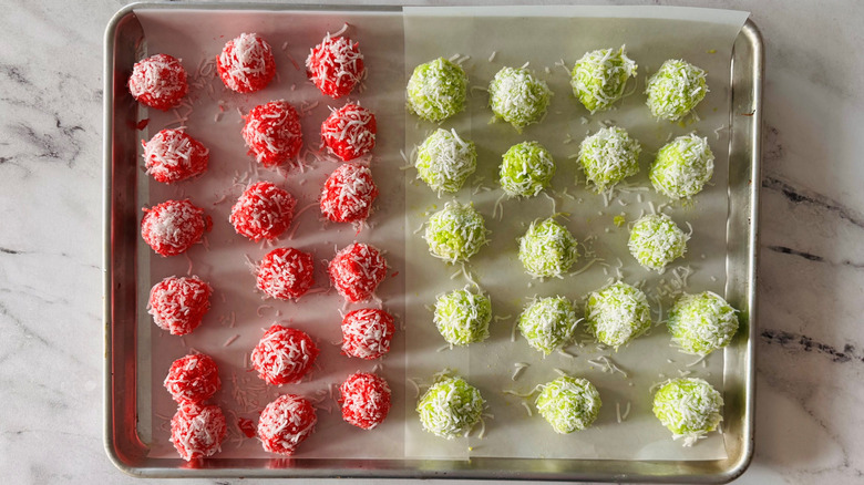 Red and green Jell-O balls on baking sheet