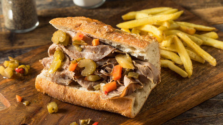 An italian beef sandwich and french fries
