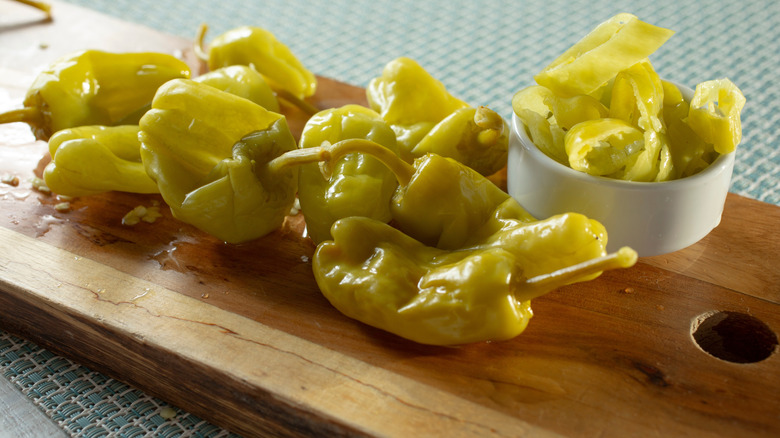 Pepperoncini on a tray, both whole and sliced