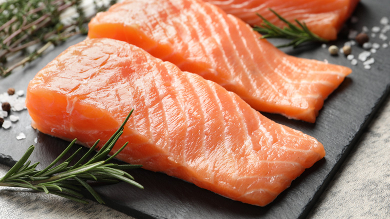 Salmon fillets on a slate slab.