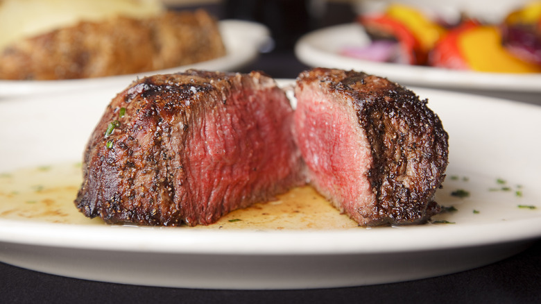 Halved pink cooked steak