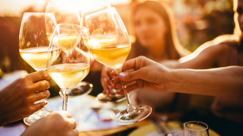 friends clinking glasses during toast