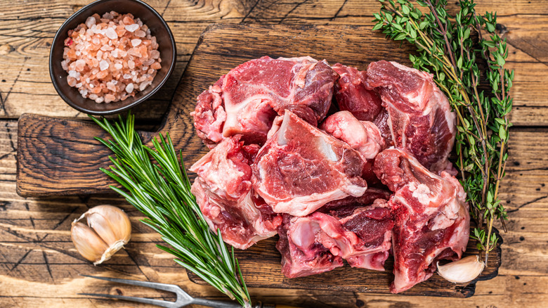 Chunks of meat with herbs, garlic, rock salt