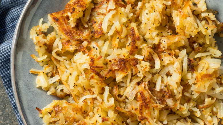 Close up of crispy hash browns on a plate