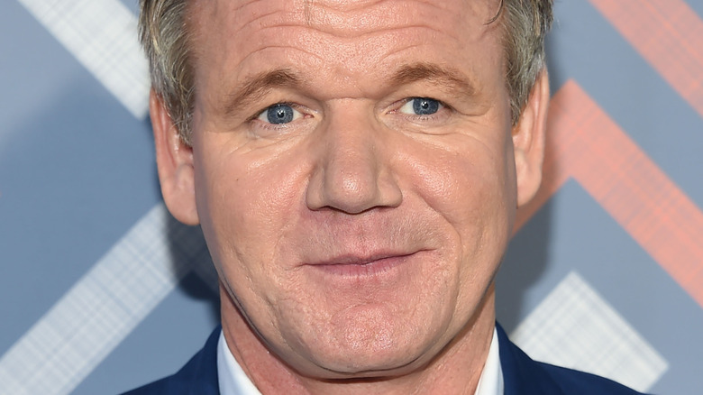 Chef Gordon Ramsay smiling on red carpet