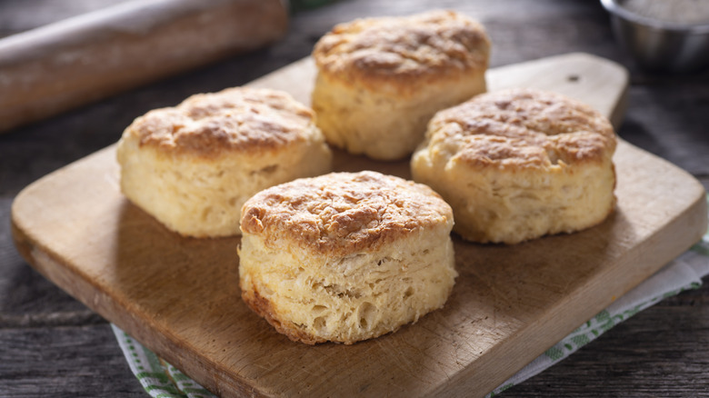 baked biscuits on cutting board