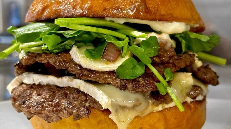 burger with brie cheese and watercress