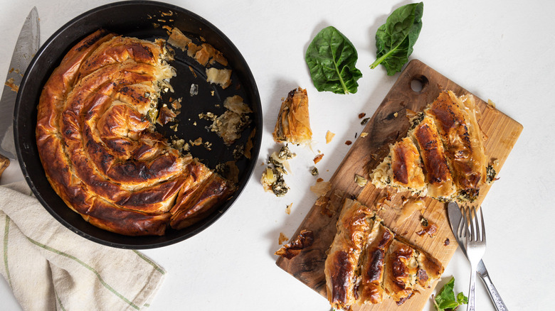 whole and sliced spanakopita spiral