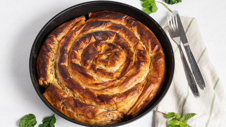 golden spiral spanakopita in dish