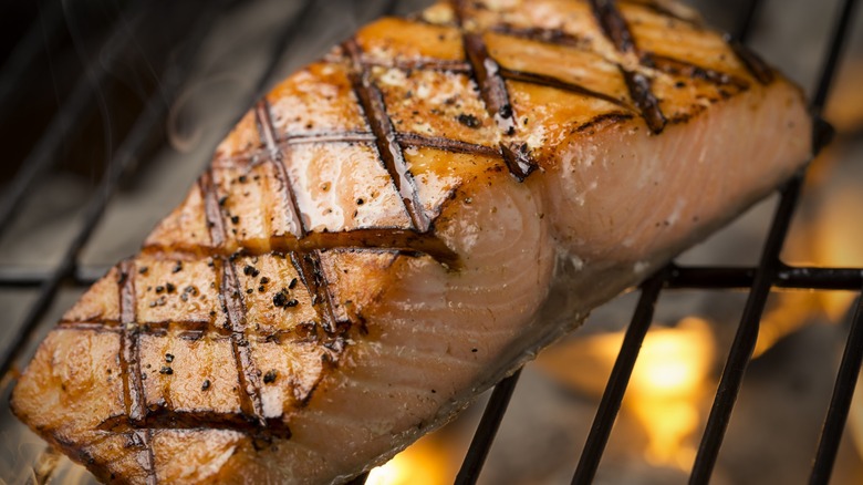Salmon cooking on a grill