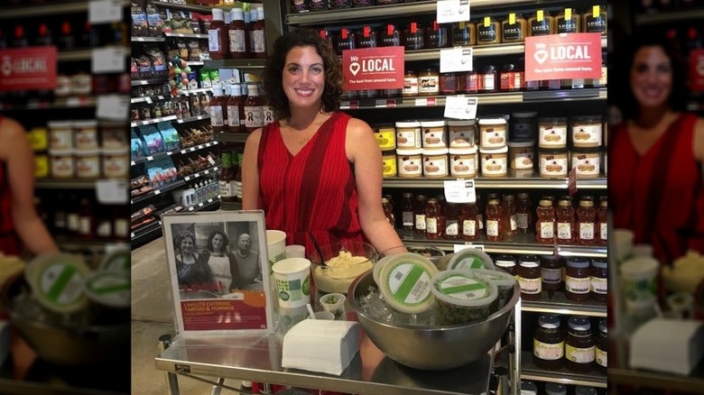 Woman handing out samples at Whole Foods