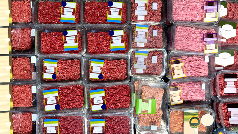 Retail cooler filled with packages of ground meat