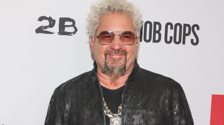 Guy Fieri smiles on the red carpet