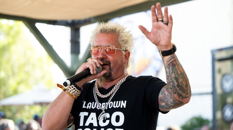 guy fieri with a microphone