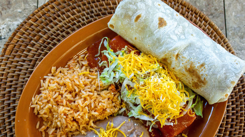 Roberto's Taco Shop's carne asada burrito with enchiladas, rice, and beans.