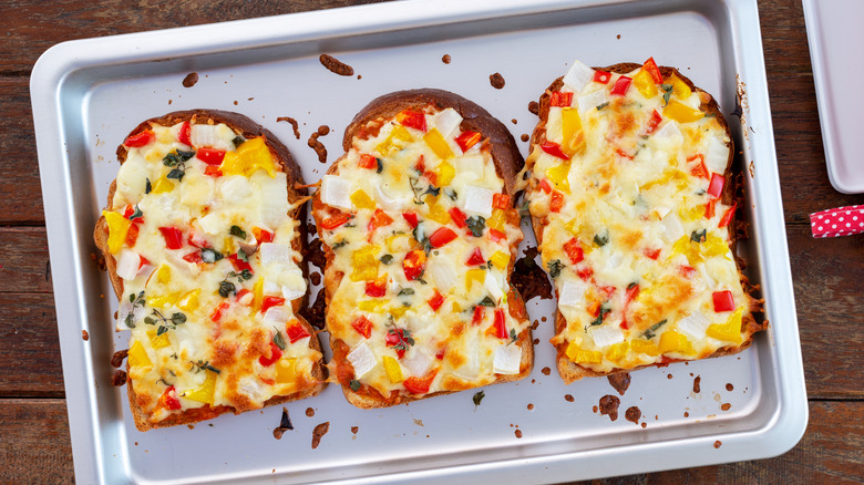 pieces of toasts with pizza toppings