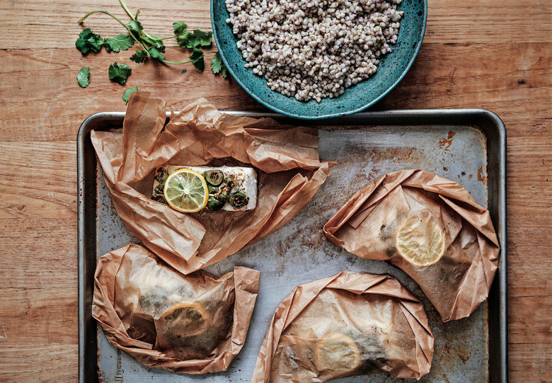 Baking halibut in parchment paper pockets yields tender, moist and flavorful results, with minimal cleanup.