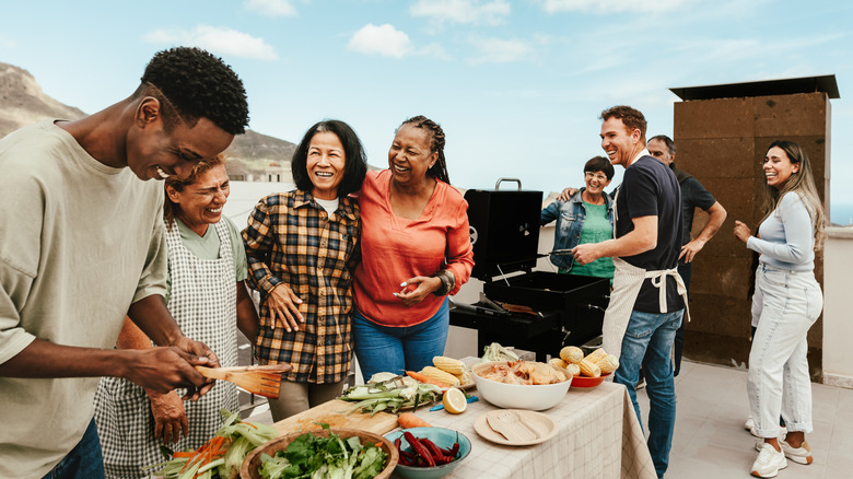 People socializing at a barbecue.