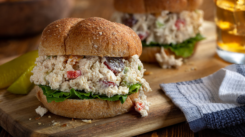 Chicken salad sandwich with halved grapes and lettuce
