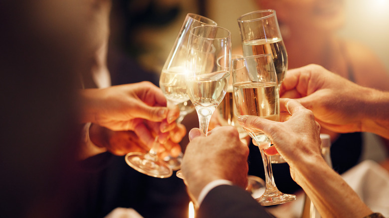 A group of people giving a champagne toast