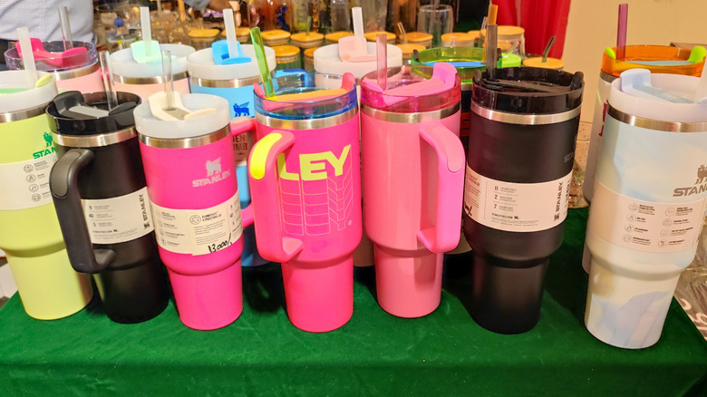 different colored Stanley cups on a table