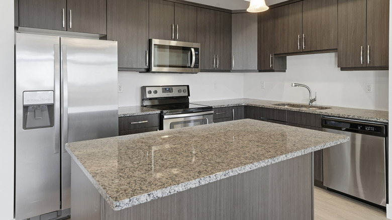 A kitchen with a granite countertop.