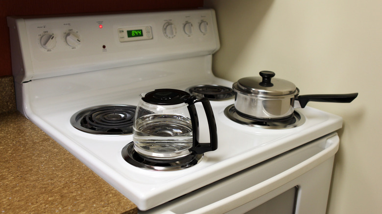 Items sit on an electric stove.