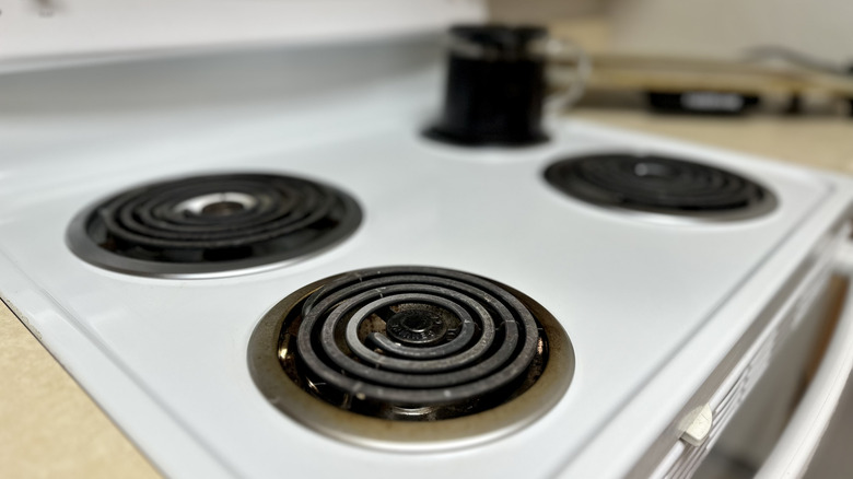 Stove burner needing maintenance