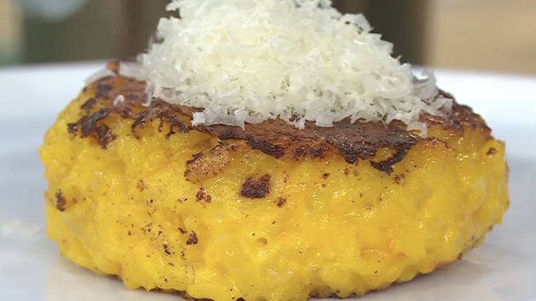 Riso al salto topped with cheese.