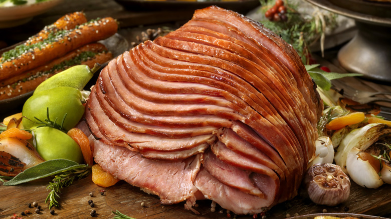 Glazed ham on a wooden board