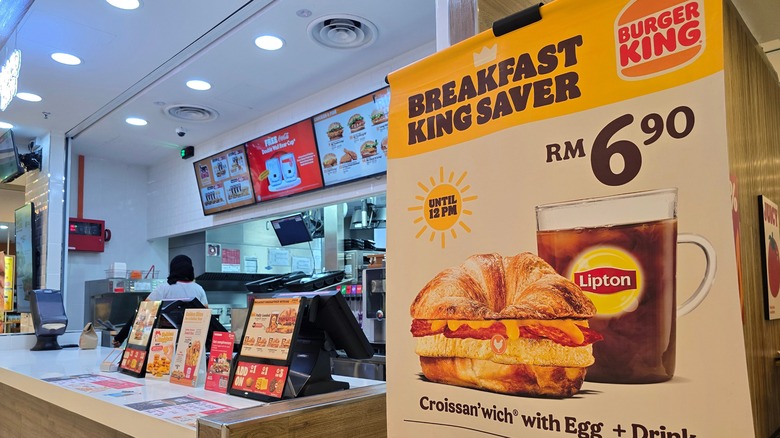 Inside Burger King with breakfast sandwich sign