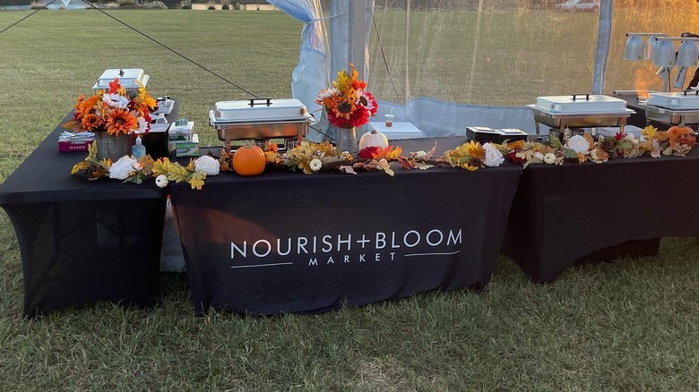 A Nourish + Bloom Market pop up stall