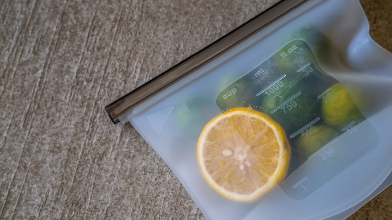 Reusable silicone bag with lemon and Brussels sprouts inside