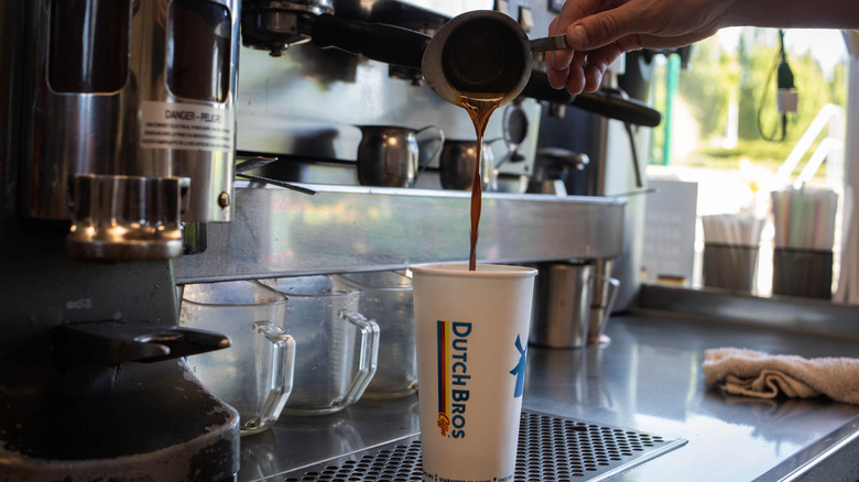 Barista pouring Dutch Bros espresso