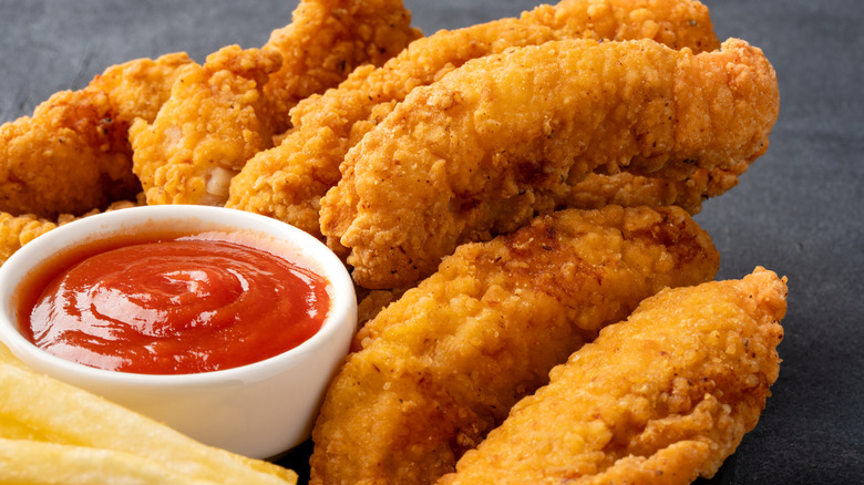 Fried chicken tenders and ketchup