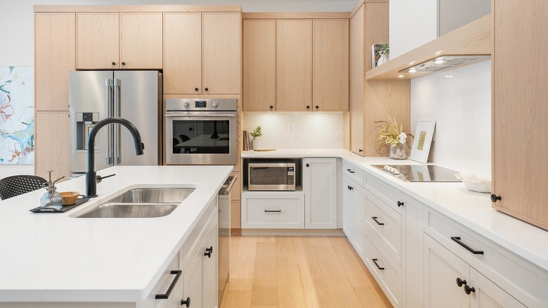 A modern kitchen with white oak cabinetry