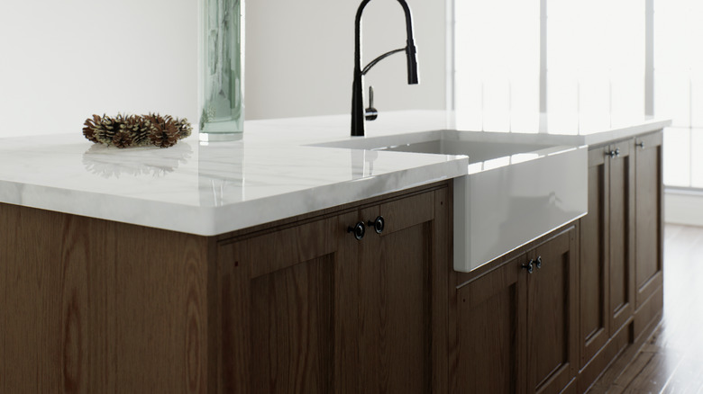 A kitchen island with a pencil edge countertop