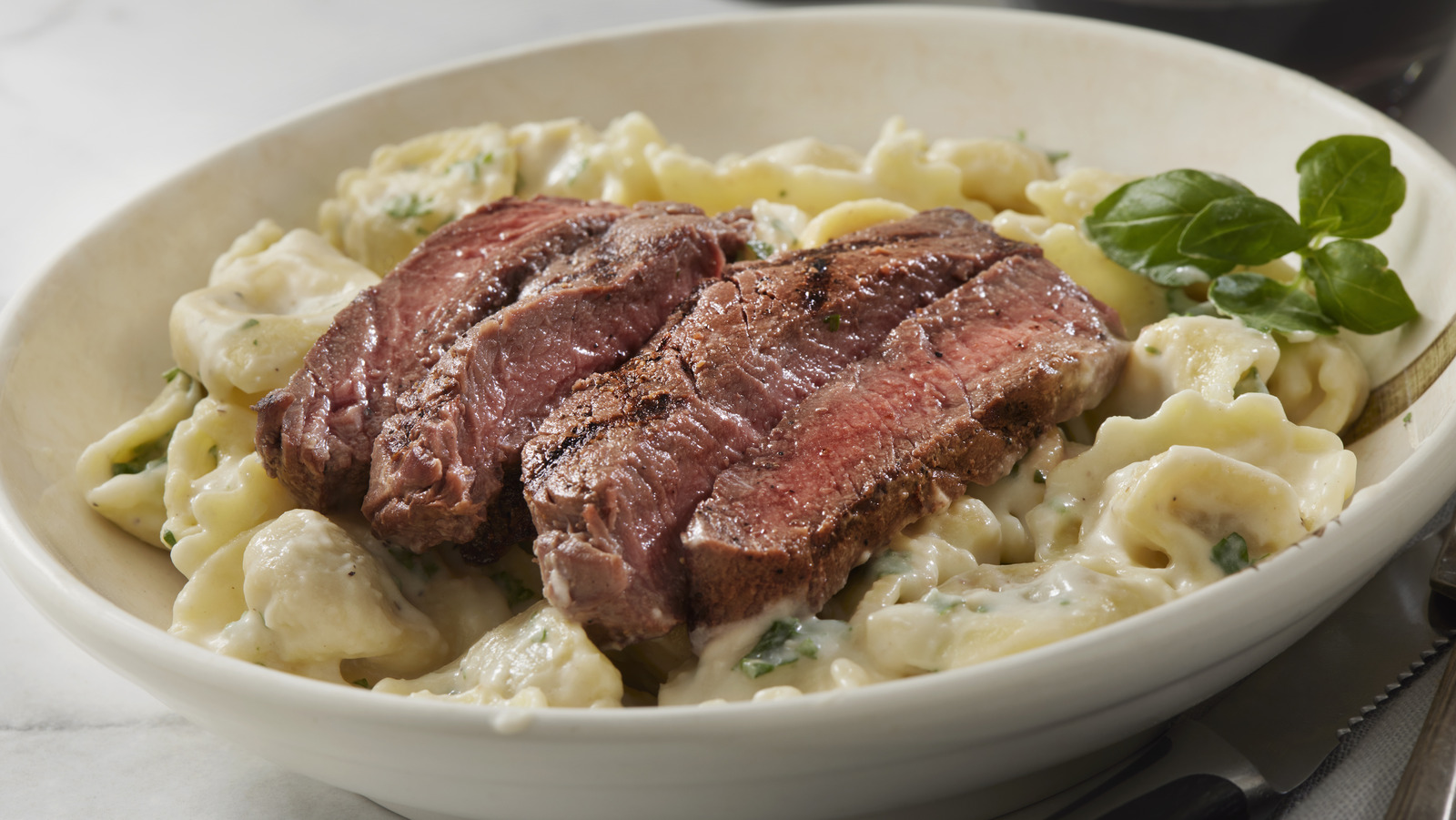 <a href="https://www.foodrepublic.com/1736774/pasta-steak-pairing-italy/" target="_blank">Here’s Why You Won’t Traditionally See Pasta Served Alongside Steak In Italy</a>