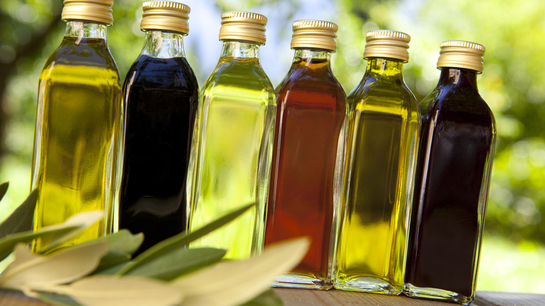 Lineup of different colored vinegar bottles