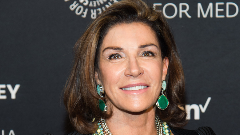 Hilary Farr wearing large earrings and a bold necklace